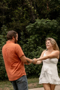 Couple dancing outdoors for Waco engagement session