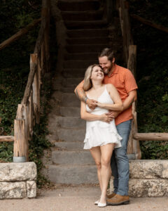 Engaged couple dancing in outdoor Waco park