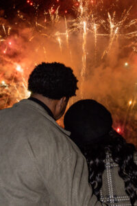 Couple watching fireworks at engagement session