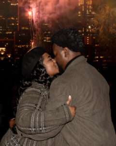 Couple kissing in front of fireworks at Auditorium Shores, Austin