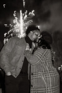 Couple kissing at firework proposal at Auditorium Shores, Austin