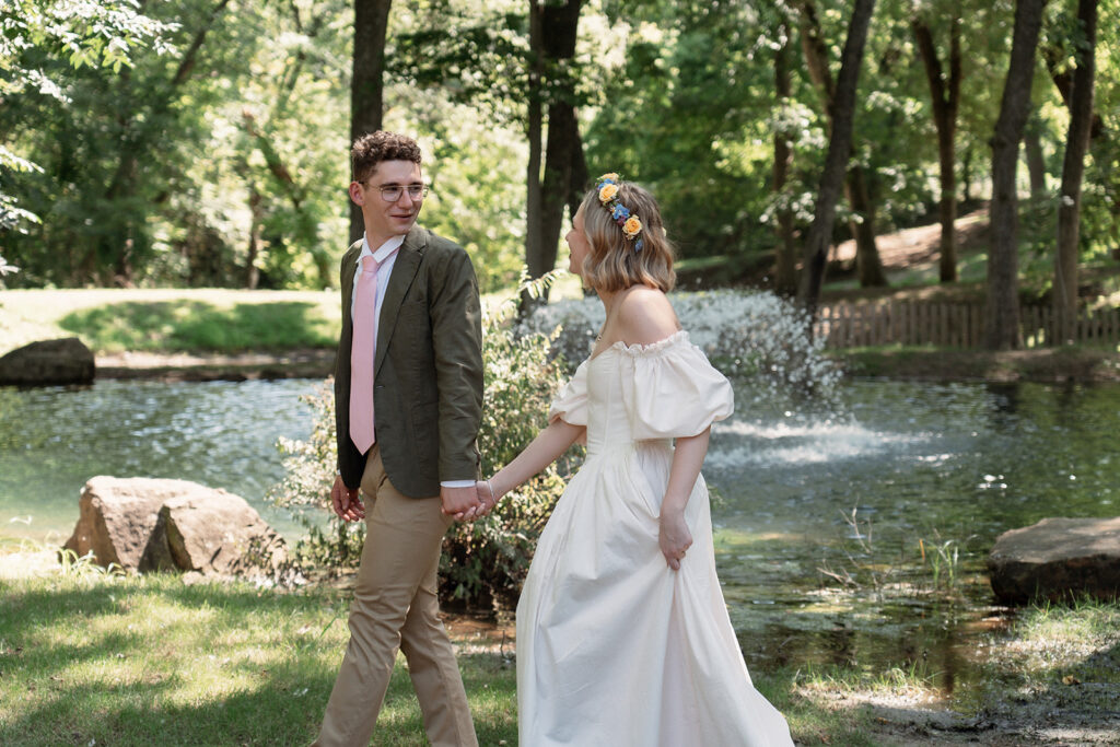 Bride and groom taking photos before the ceremony in a forest.