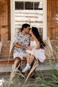 Engaged couple kissing at Magnolia in Waco