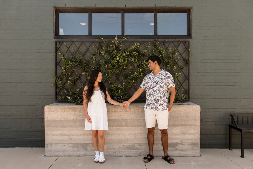 Couple taking engagement photos near Magnolia in Waco, Texas