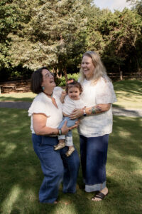 Family playing in park during Waco engagement session