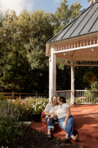 Couple in front of gazebo during engagement session