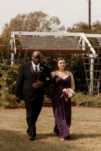 Best man and maid of honor walking down the aisle