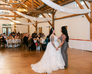 Mother of bride and bride dancing