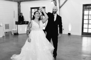 Father of bride and bride dancing