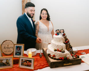 Bride and groom cutting cake