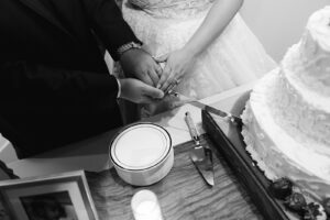 Bride and groom cutting cake