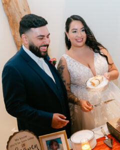 Bride and groom cutting cake