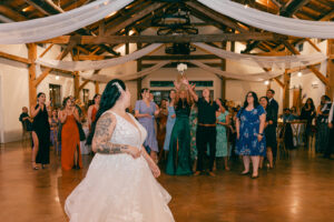 Bride throwing bouquet