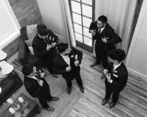 Groom and groomsmen getting ready in groom's cabin at Deerfield Estates