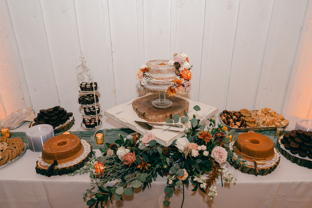 wedding cake with dessert table