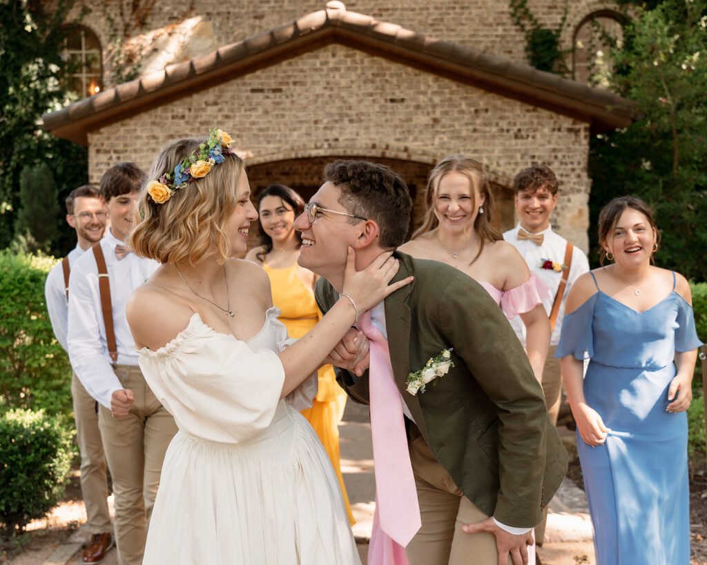 Bride and groom with bridal party for summer wildflower wedding