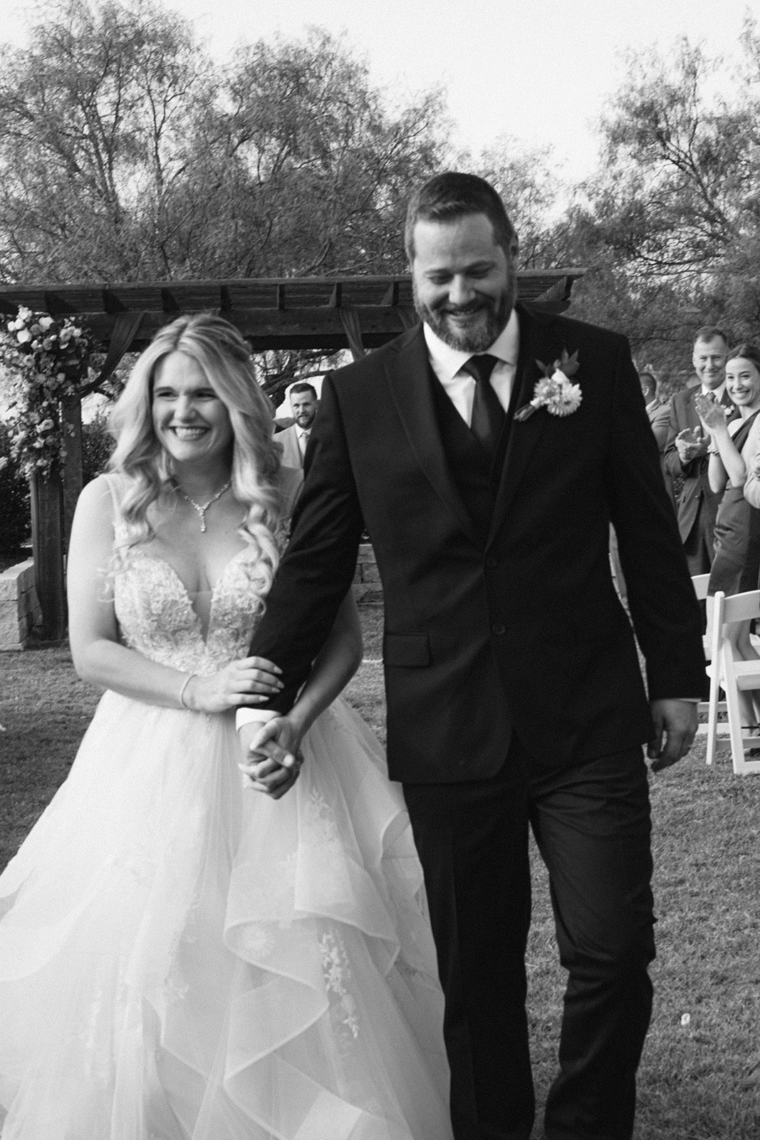 Bride and groom walking down the aisle after wedding ceremony