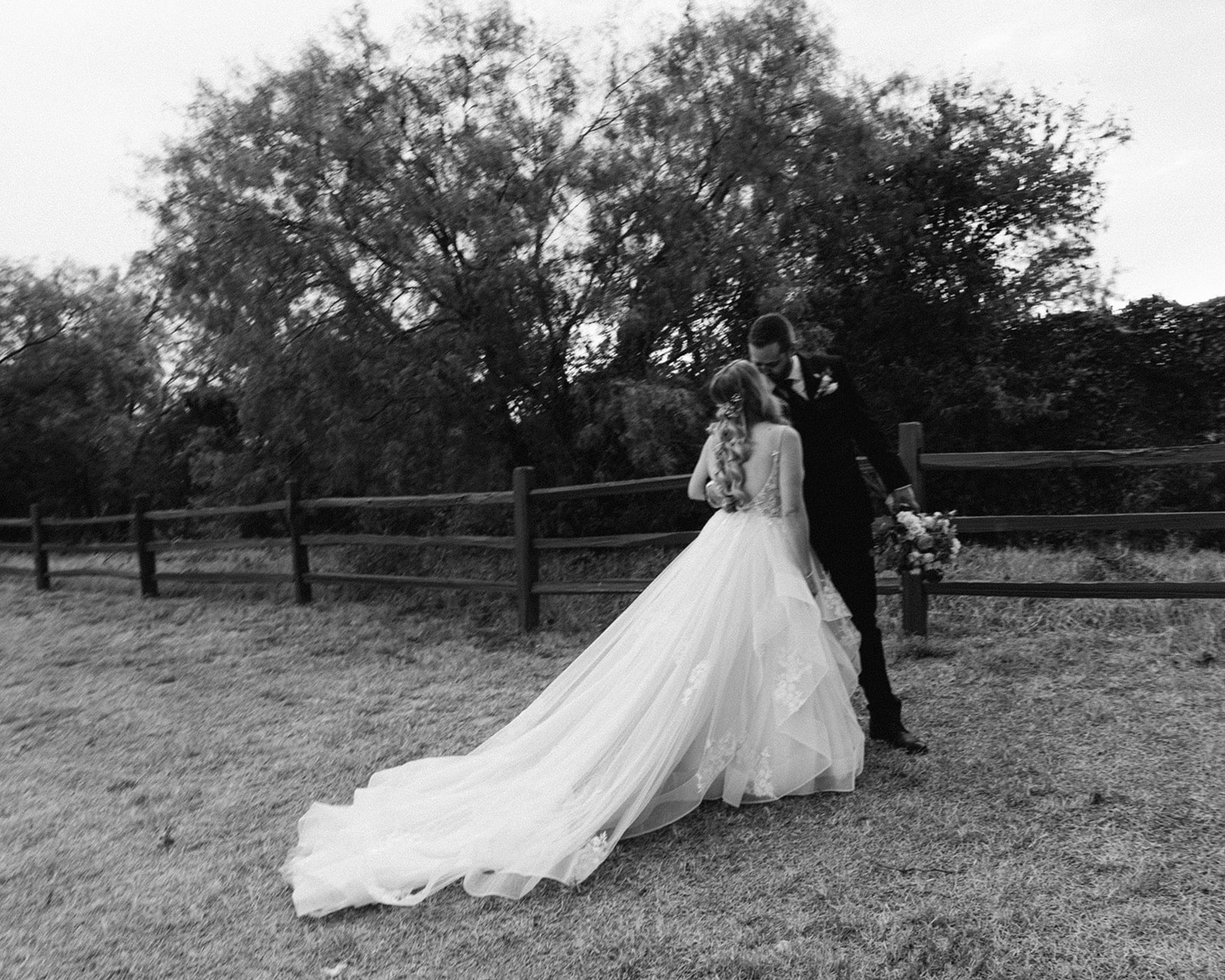 Bride and groom kiss outside after ceremony