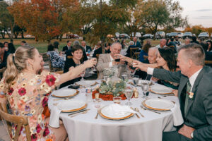 Callie + Al Guests toasting at wedding reception