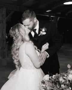 Callie + Al Bride and groom kiss at cake cutting