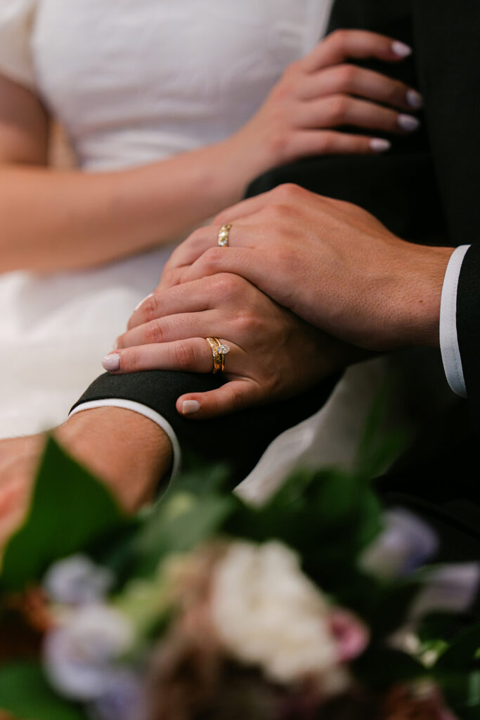 Bride and groom rings after Catholic wedding