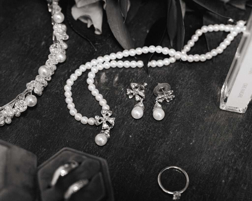 Detail shot of rings and wedding jewelry